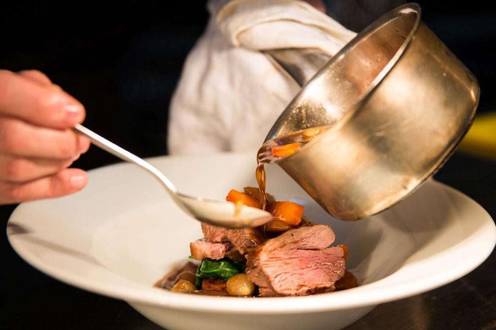 The Millstone, Mellor Hotel Blackburn  Bagian luar foto A chef plating a dish